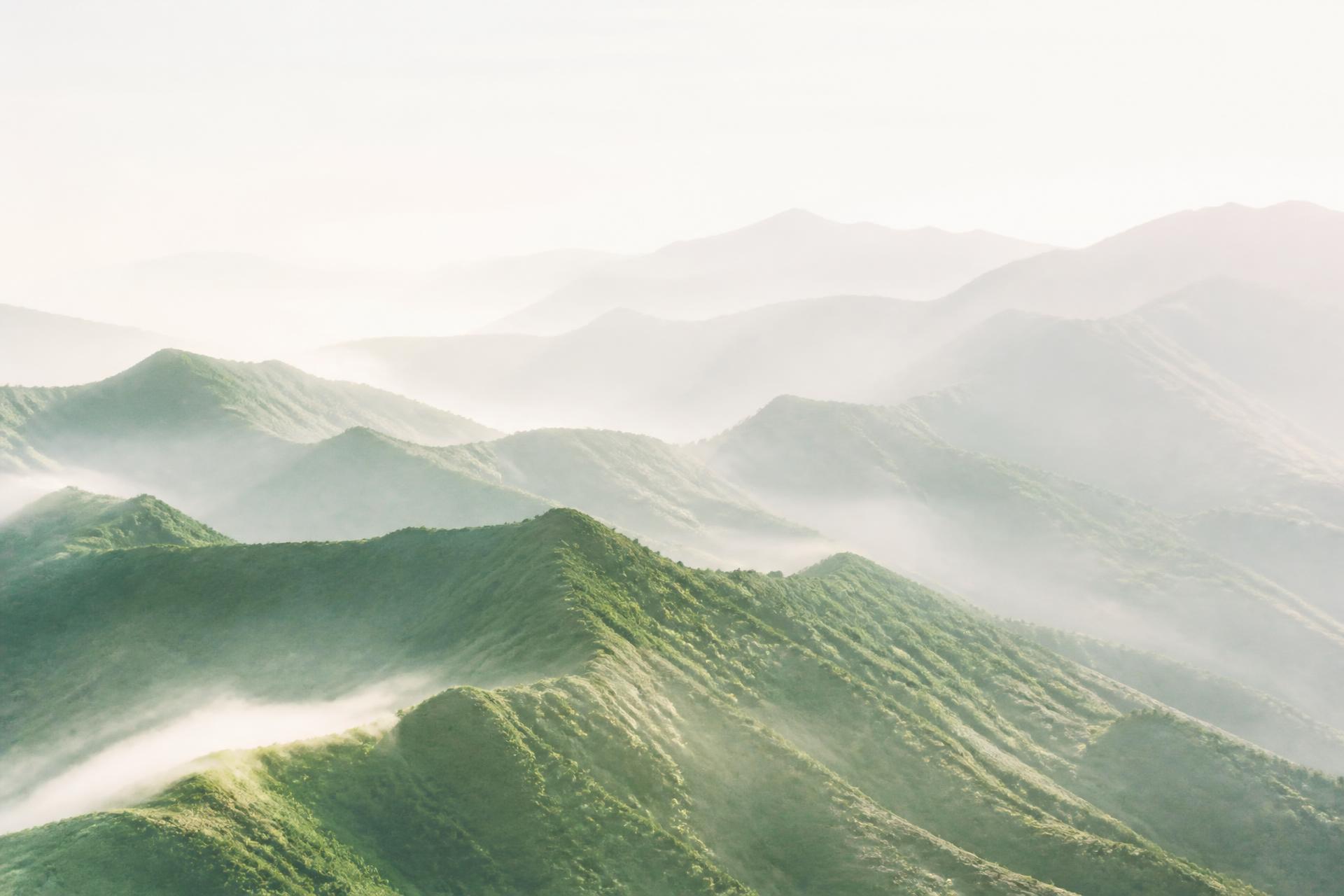 Layered mountain ridges at dawn